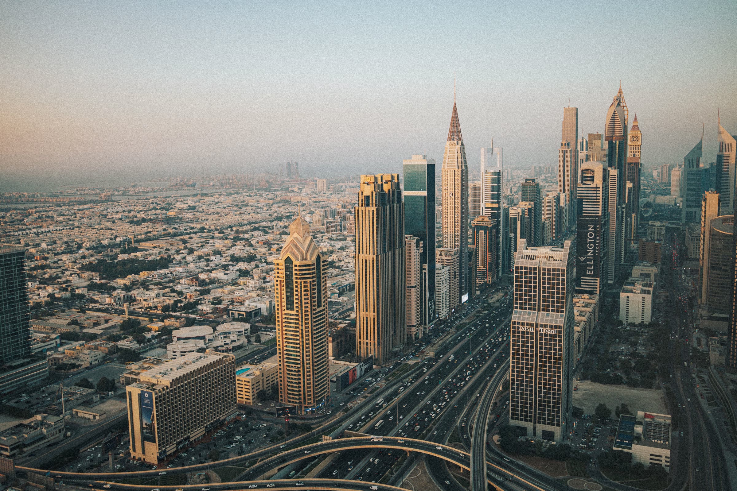 Dubai skyline at dusk along Sheikh Zayed Road